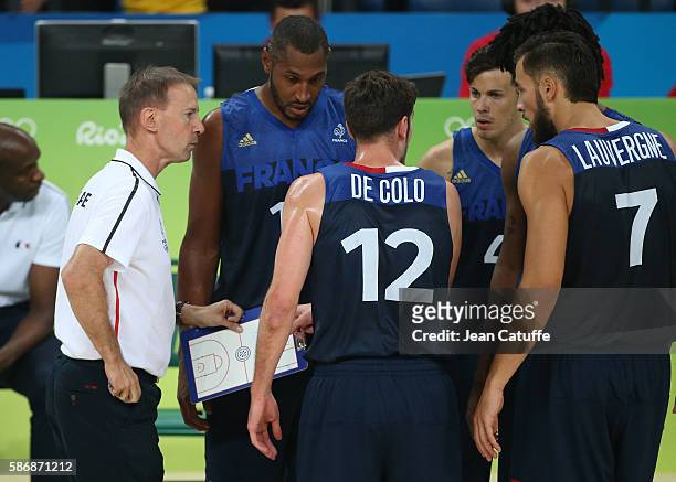 Coach of France Vincent Collet talks with Boris Diaw, Nando De Colo, Thomas Heurtel, Joffrey Lauvergne and Mickael Gelabale of France during the...