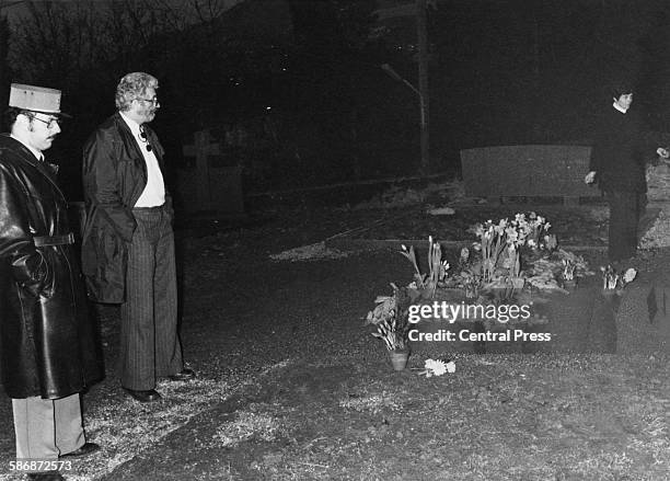Police at the desecrated grave of English film actor and director Charlie Chaplin in the cemetery at Corsier-sur-Vevey, Switzerland, March 1978....