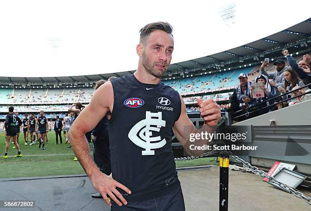 Andrew Walker of the Blues leaves the field after playing his final AFL match during the round 20 AFL match between the Carlton Blues and the St...