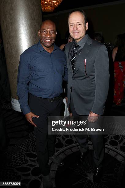 Filmmaker John Singleton and President of FX John Landgraf attend the 32nd annual Television Critics Association Awards during the 2016 Television...
