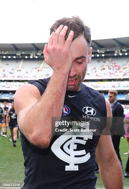 Andrew Walker of the Blues leaves the field after playing his final AFL match during the round 20 AFL match between the Carlton Blues and the St...