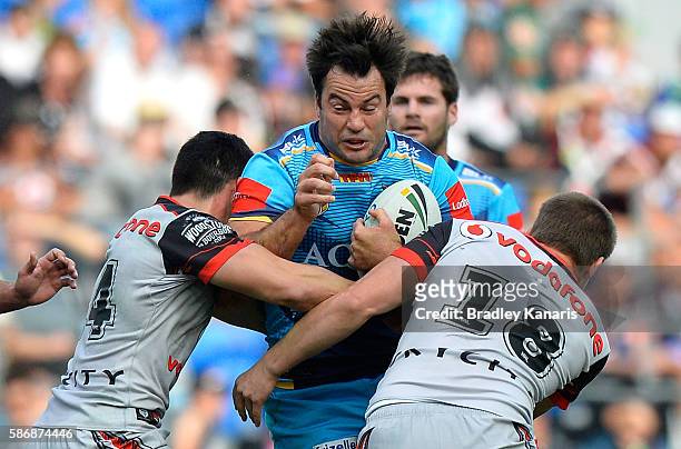 David Shillington of the Titans takes on the defence during the round 22 NRL match between the Gold Coast Titans and the New Zealand Warriors at Cbus...