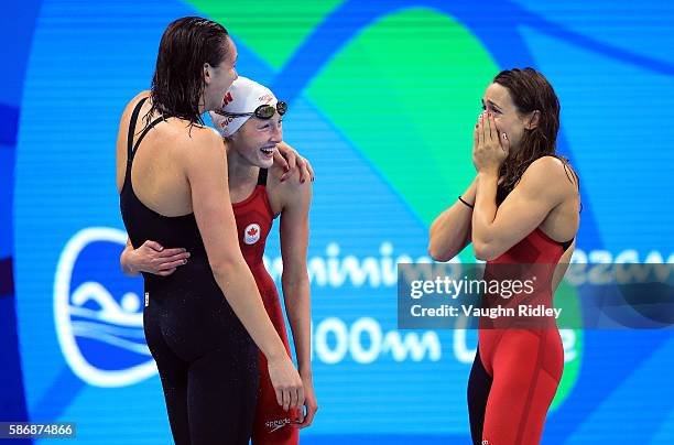 Chantel Van Landeghem , Taylor Ruck and Sandrine Mainville of Canada celebrate as they win Bronze in the Women's 4x100m Freestyle Final on Day 1 of...