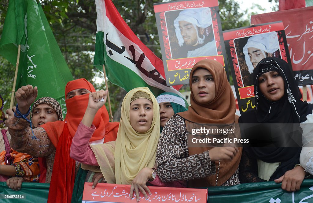 Activists of Pakistan Awami Tehreek (PAT) organisation take...