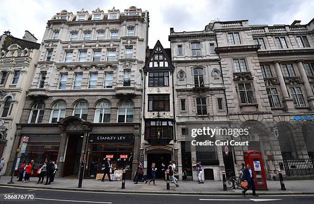 People walk past Ye Olde Cock Tavern, a pub once popular with journalists, in Fleet Street, on August 5, 2016 in London, England. The last two...