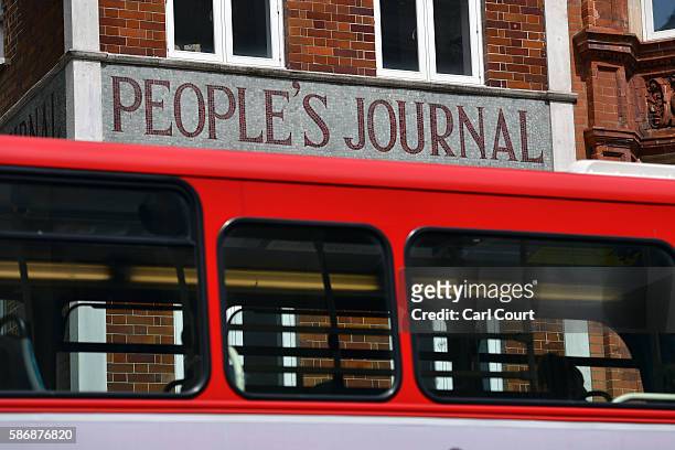 Bus passes the Sunday Post building in Fleet Street, on August 5, 2016 in London, England. The last two remaining journalists finished their jobs...