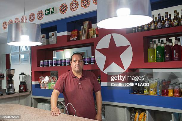 Daniel BOSQUE - Special delegate for North Korea's Committee for Cultural Relations with Foreign Countries, Alejandro Cao de Benos poses in his bar...