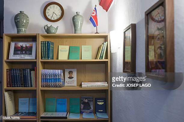 Daniel BOSQUE - A library section is pictured in the bar "Pyongyangcafe" dedicated to friends of the Democratic People's Republic of Korea on July...