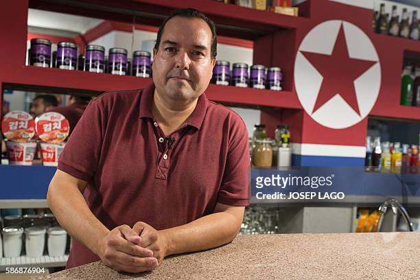 Daniel BOSQUE - Special delegate for North Korea's Committee for Cultural Relations with Foreign Countries, Alejandro Cao de Benos poses in his bar...