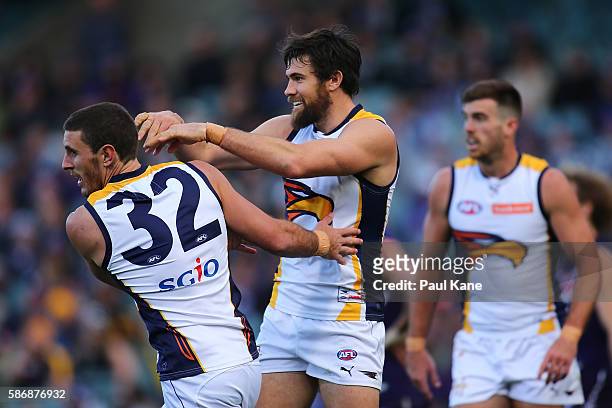 Josh Kennedy and Simon Tunbridge of the Eagles celebrate a goal during the round 20 AFL match between the Fremantle Dockers and the West Coast Eagles...