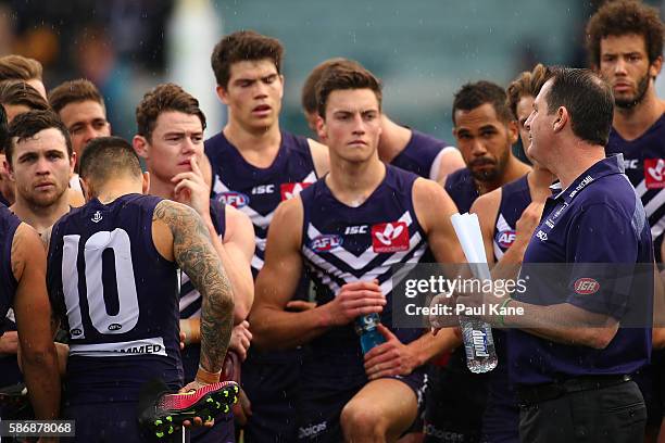 Dockers head coach Ross Lyon addresses his players after being defeated during the round 20 AFL match between the Fremantle Dockers and the West...