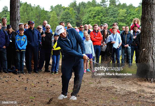 Anthony Wall of England takes his second shot from the trees on hole 1 on day four of the Aberdeen Asset Management Paul Lawrie Matchplay at...