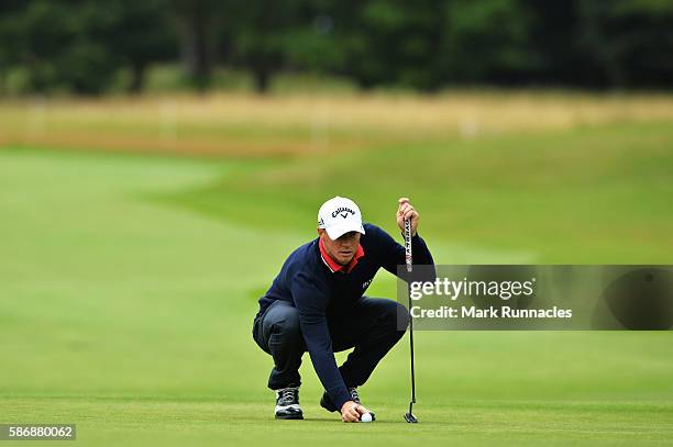 Alex Noren of Sweden lines up a putt on hole 1 on day four of the Aberdeen Asset Management Paul Lawrie Matchplay at Archerfield Links Golf Club on...