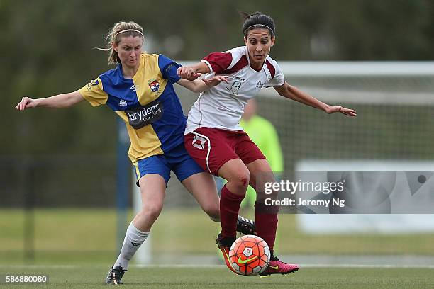 Elizabeth O'Reilly of Sydney University SFC and Leena Khamis of the Rams compete for the ball during the Round 18 NPL Women's match between Sydney...