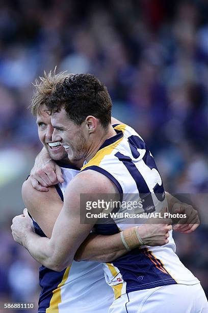 Mark LeCras of the Eagles celebrates with team mate Luke Shuey after scoring a goal during the round 20 AFL match between the Fremantle Dockers and...