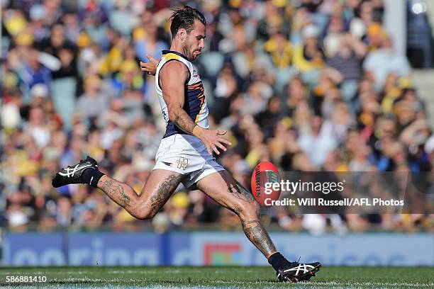 Chris Masten of the Eagles kicks the ball during the round 20 AFL match between the Fremantle Dockers and the West Coast Eagles at Domain Stadium on...