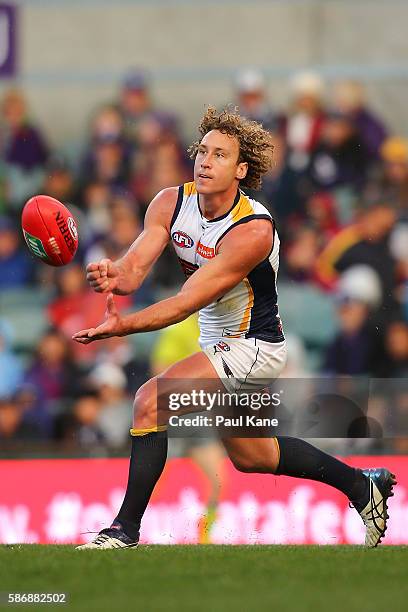 Matt Priddis of the Eagles handballs during the round 20 AFL match between the Fremantle Dockers and the West Coast Eagles at Domain Stadium on...