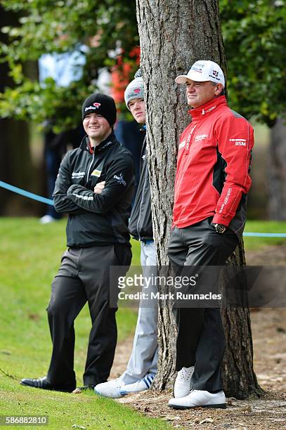 Paul Lawrie of Scotland watches the final match between Alex Noren of Sweden and Anthony Wall of England on day four of the Aberdeen Asset Management...