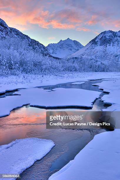 colorful sunrise over a stream at the eagle river nature center in chugach state park, southcentral alaska, winter, hdr - brooke payne stock pictures, royalty-free photos & images