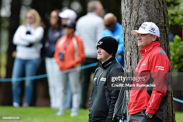 Paul Lawrie of Scotland watches the final match between Alex Noren of Sweden and Anthony Wall of England at the green on hole 7 on day four of the...
