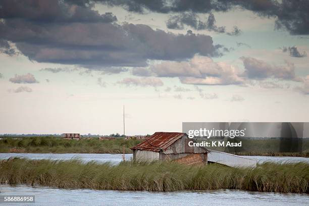 House is destroyed by the floodwater near Gaibandha. Bangladesh has been suffering from devastating monsoon floods from the middle of July. Causes of...