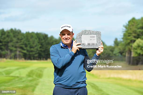 Anthony Wall of England with his trophy for winning the tournament on day four of the Aberdeen Asset Management Paul Lawrie Matchplay at Archerfield...