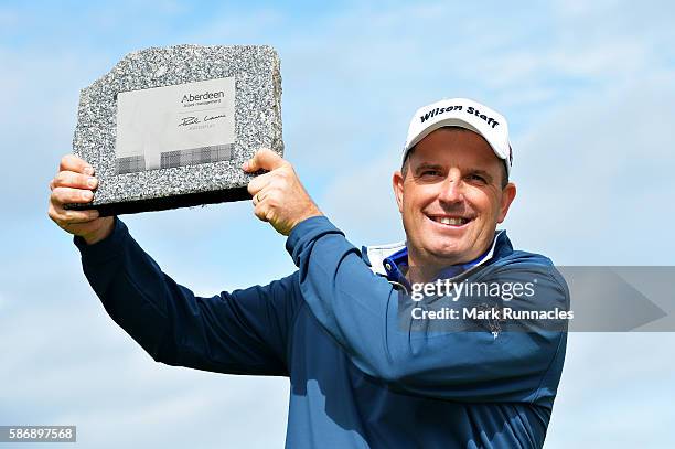 Anthony Wall of England with his trophy for winning the tournament on day four of the Aberdeen Asset Management Paul Lawrie Matchplay at Archerfield...