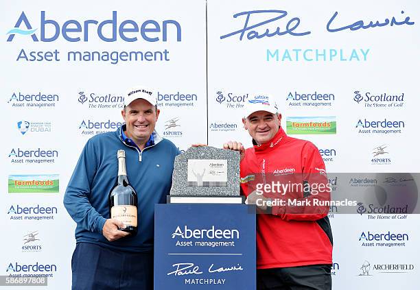 Anthony Wall of England with his winners trophy and tournament host Paul Lawrie of Scotland on day four of the Aberdeen Asset Management Paul Lawrie...