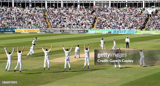 Chris Woakes and the England slip fielders appeal for the wicket of Yasir Shah of Pakistan during day five of the 3rd Investec Test between England...