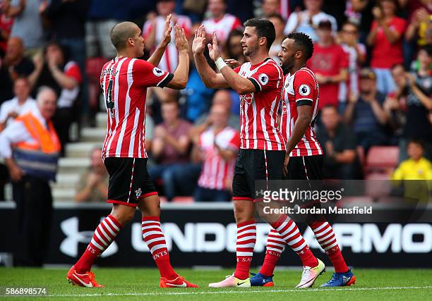Shane Long of Southampton celebrates with Oriol Romeu of Southampton after scoring his sides first goal during the pre-season friendly between...