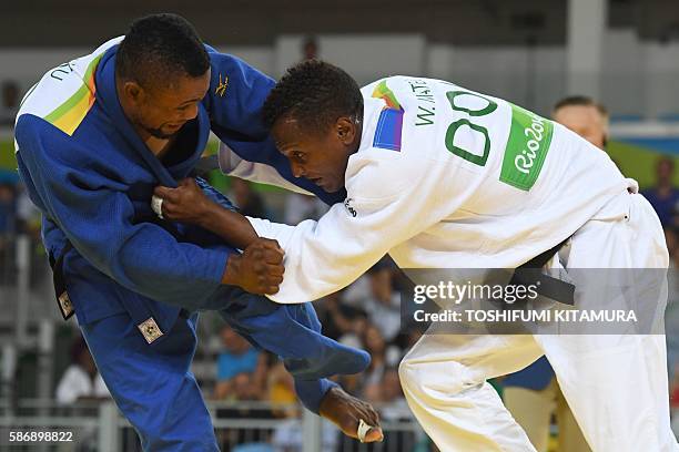 Dominican Republic's Wander Mateo competes with DR Congo's Rodrick Kuku during their men's -66kg judo contest match of the Rio 2016 Olympic Games in...