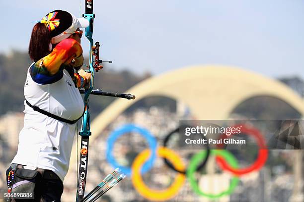 Carolina Aguirre of Colombia scores a 3 and loses the match during the Women's Team Eliminations match between India and Colombia on Day 2 of the Rio...