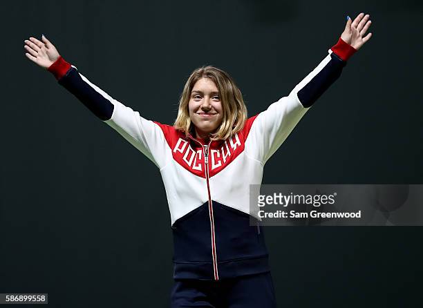 Silver Medalist Vitalina Batsarashkina of Russia acknowledges the crowd during the medal ceremony for the Wome's 10m Air Pistol event during the...
