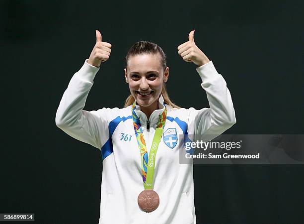 Bronze Medalist Anna Korakaki of Greece smiles during the medal ceremony for the Women's 10m Air Pistol event during the shooting competition on Day...