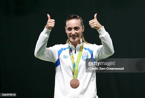 Bronze Medalist Anna Korakaki of Greece smiles during the medal ceremony for the Women's 10m Air Pistol event during the shooting competition on Day...