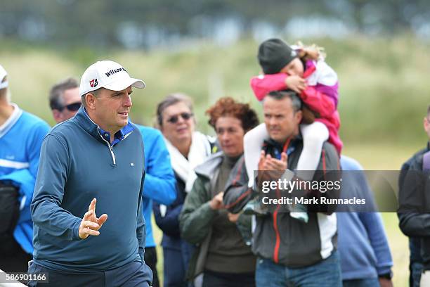 Anthony Wall of England reacts to the crowds applause after a good chip shot on hole 15 on day four of the Aberdeen Asset Management Paul Lawrie...
