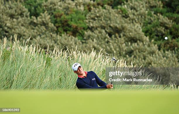 Alex Noren of Sweden pitches onto the green on hole 16 on day four of the Aberdeen Asset Management Paul Lawrie Matchplay at Archerfield Links Golf...