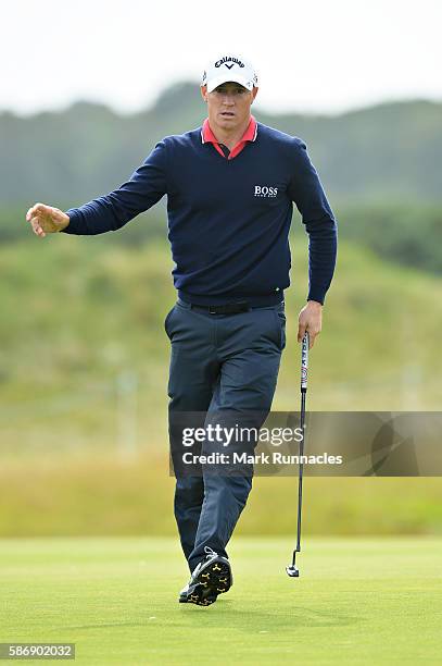 Alex Noren of Sweden reacts to the crowds applause on the green on hole 16 on day four of the Aberdeen Asset Management Paul Lawrie Matchplay at...