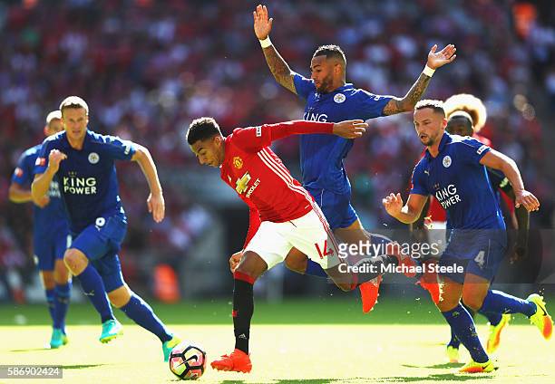 Jesse Lingard of Manchester United skips past Danny Simpson of Leicester City on the way to scoring the first goal during The FA Community Shield...
