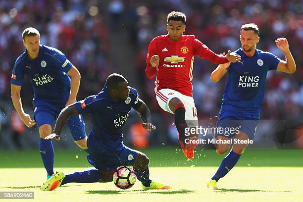 Jesse Lingard of Manchester United escapes a challenge from Wes Morgan of Leicester City during The FA Community Shield match between Leicester City...