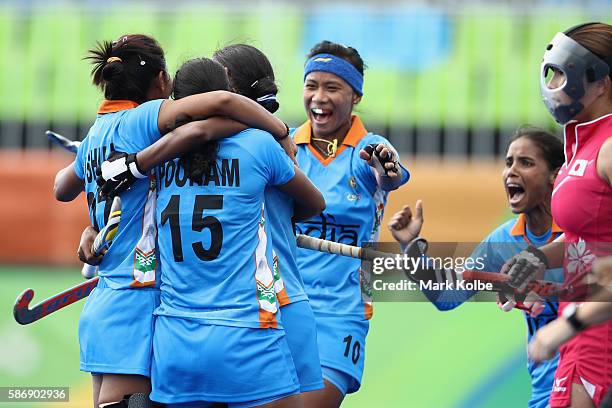 Rani of India celebrates with her team mates after scoring a goal during the women's pool B match between Japan and India on Day 2 of the Rio 2016...