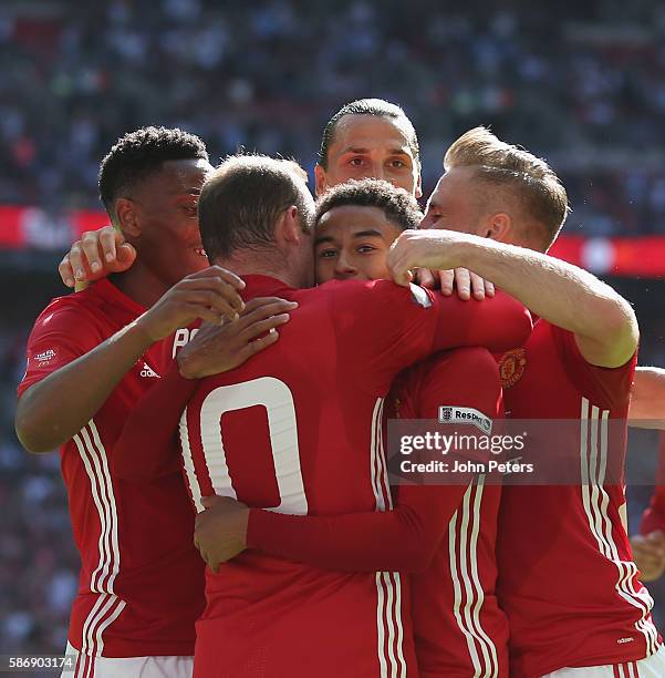 Jesse Lingard of Manchester United celebrates scoring their first goal during the FA Community Shield match between Leicester City and Manchester...