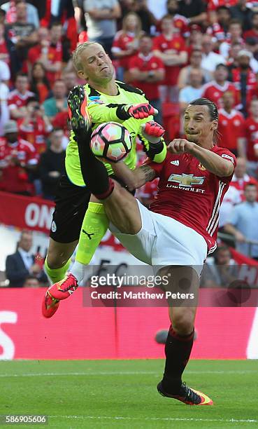 Zlatan Ibrahimovic of Manchester United in action with Kasper Schmeichel of Leicester City during the FA Community Shield match between Leicester...
