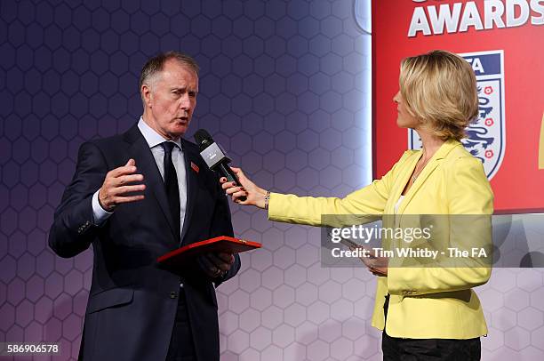 Jacqui Oatley on stage with Sir Geoff Hurst at the McDonalds Community Awards at Wembley Stadium on August 7, 2016 in London, England. The McDonalds...