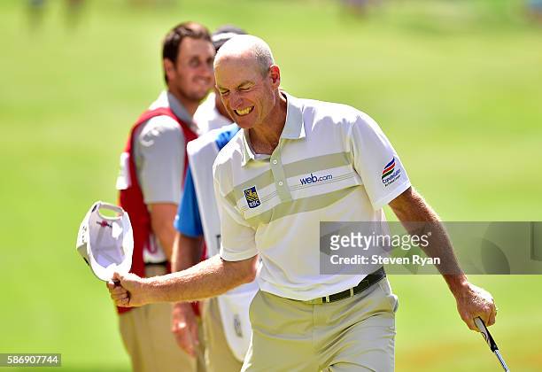 Jim Furyk of the United States celebrates after shooting a record setting 58 during the final round of the Travelers Championship at TCP River...
