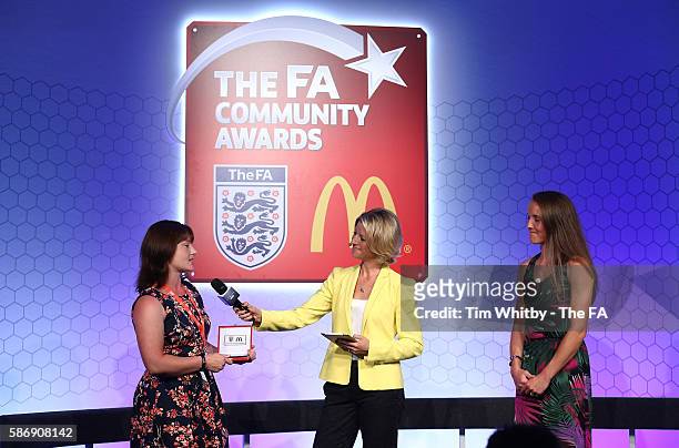 Jacqui Oatley and Casey Stoney on stage with the winner of the Volenteer of the Year Award, Lindsay Carrington at the McDonalds Community Awards at...