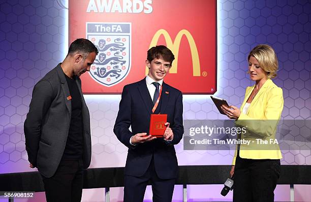 Jacqui Oatley and Ryan Giggs on stage with the winner of the Young Volenteer of the Year Award, Peter Harding at the McDonalds Community Awards at...