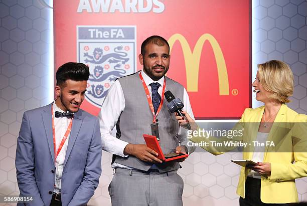 Jacqui Oatley on stage with the winners of the FA Charter Standard Club Award, Alpha United Juniors at the McDonalds Community Awards at Wembley...