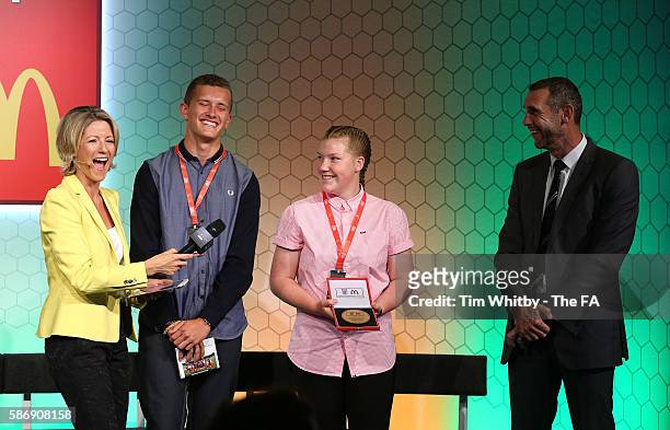 Jacqui Oatley on stage with the winners of the FA Charter Standard Development Club Award, Foots Cray Lions JFC at the McDonalds Community Awards at...