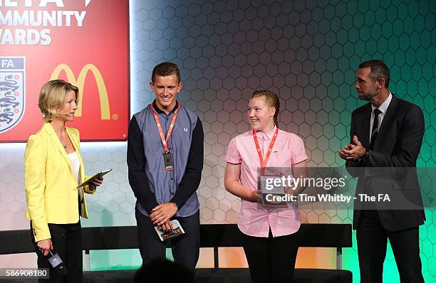 Jacqui Oatley on stage with the winners of the FA Charter Standard Development Club Award, Foots Cray Lions JFC at the McDonalds Community Awards at...